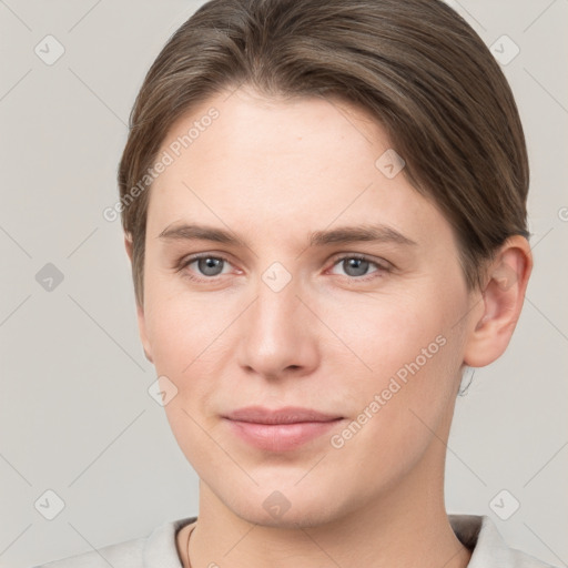 Joyful white young-adult female with short  brown hair and grey eyes