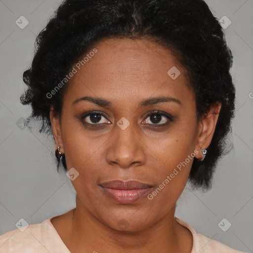 Joyful black adult female with short  brown hair and brown eyes