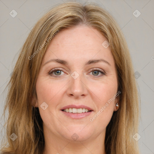 Joyful white adult female with long  brown hair and brown eyes