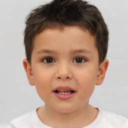 Joyful white child male with short  brown hair and brown eyes