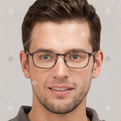 Joyful white young-adult male with short  brown hair and grey eyes