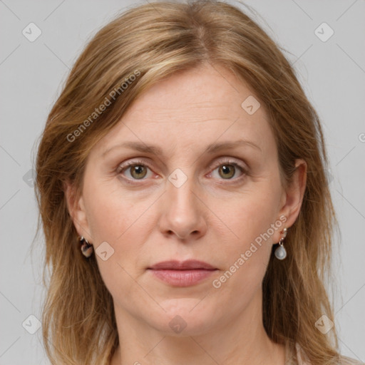 Joyful white adult female with medium  brown hair and grey eyes