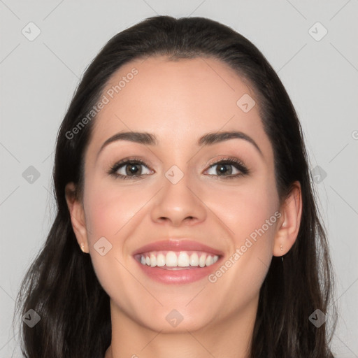 Joyful white young-adult female with long  black hair and brown eyes