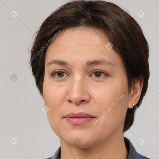 Joyful white adult female with short  brown hair and brown eyes