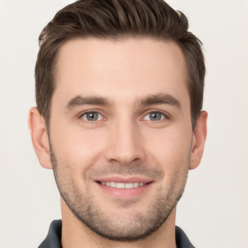 Joyful white young-adult male with short  brown hair and brown eyes