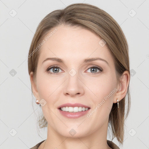 Joyful white young-adult female with medium  brown hair and grey eyes