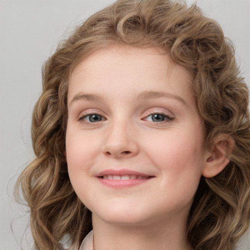 Joyful white child female with long  brown hair and blue eyes