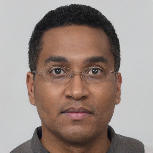 Neutral black adult male with short  black hair and brown eyes