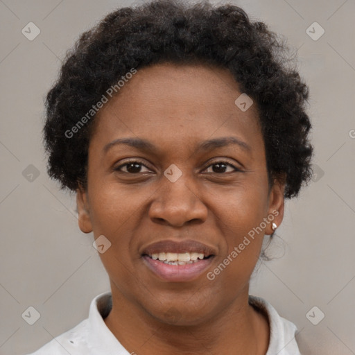 Joyful black adult female with short  brown hair and brown eyes