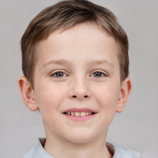 Joyful white child male with short  brown hair and grey eyes