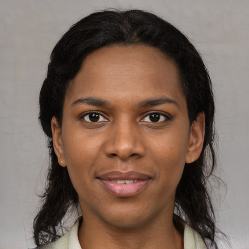 Joyful black young-adult female with medium  black hair and brown eyes