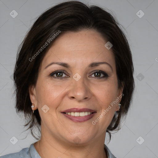 Joyful white adult female with medium  brown hair and brown eyes