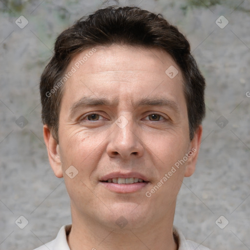 Joyful white adult male with short  brown hair and brown eyes