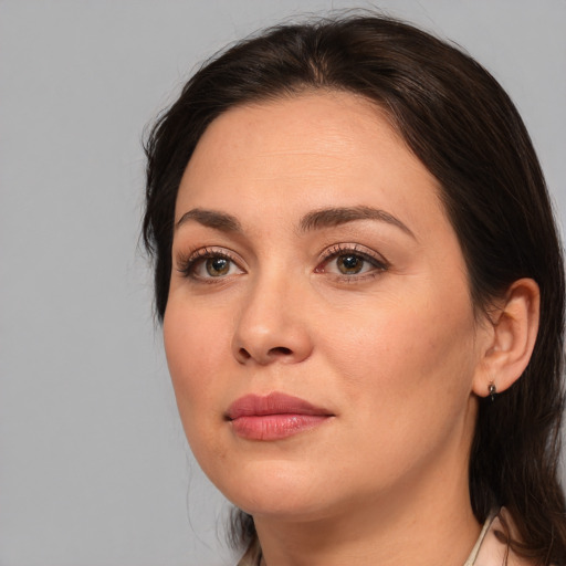 Joyful white young-adult female with medium  brown hair and brown eyes