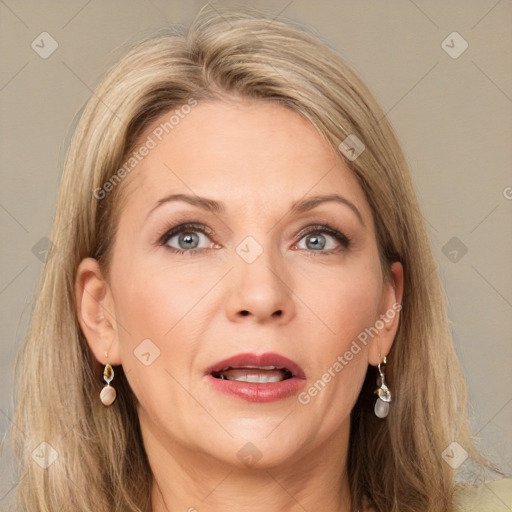 Joyful white adult female with long  brown hair and grey eyes