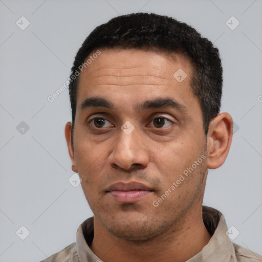 Neutral latino adult male with short  black hair and brown eyes