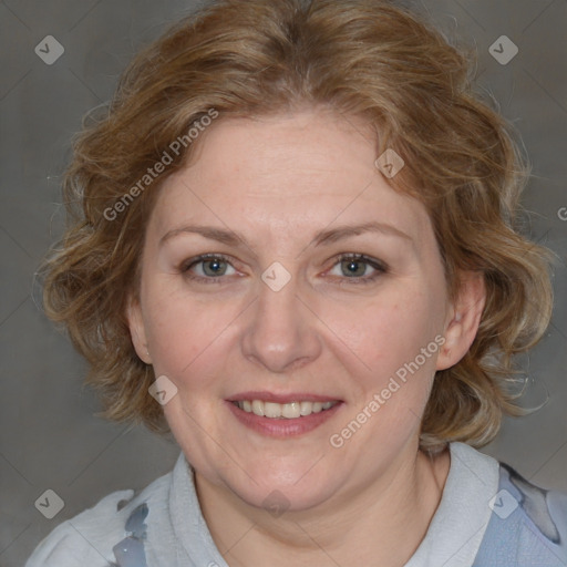 Joyful white adult female with medium  brown hair and blue eyes