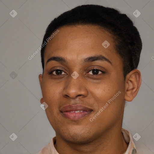 Joyful black young-adult female with short  brown hair and brown eyes