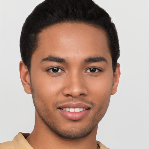 Joyful latino young-adult male with short  brown hair and brown eyes