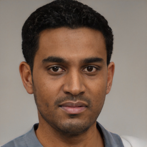 Neutral black young-adult male with short  black hair and brown eyes