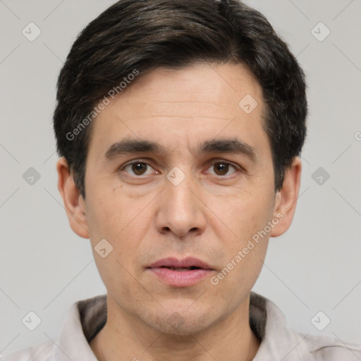 Joyful white adult male with short  brown hair and brown eyes