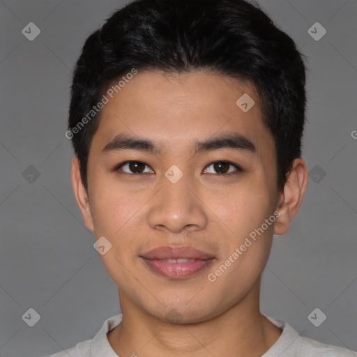 Joyful asian young-adult male with short  black hair and brown eyes