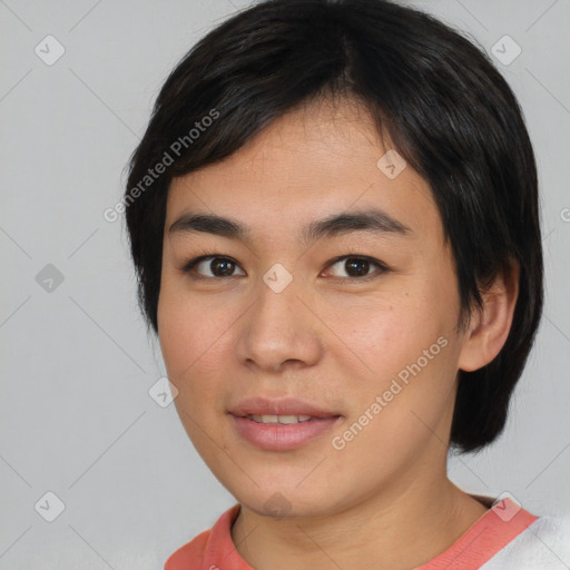 Joyful asian young-adult female with short  brown hair and brown eyes