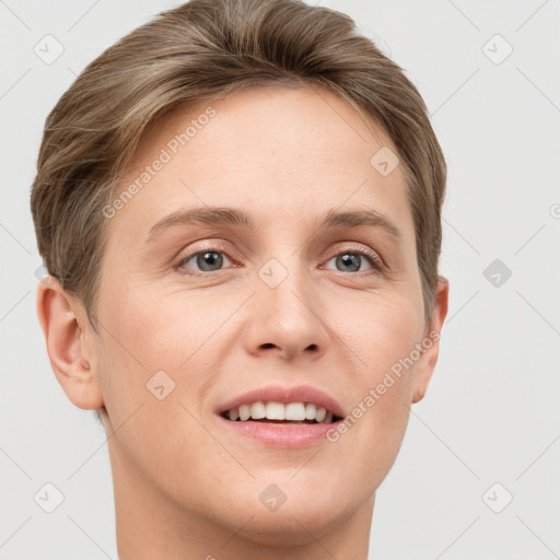 Joyful white young-adult female with short  brown hair and grey eyes