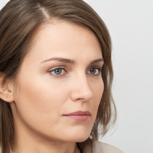 Neutral white young-adult female with long  brown hair and grey eyes