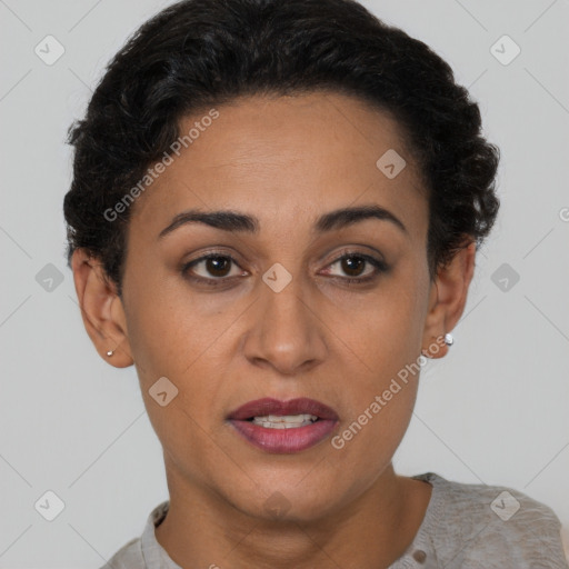 Joyful latino young-adult female with short  brown hair and brown eyes