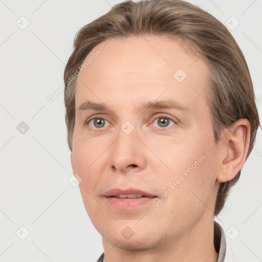 Joyful white adult male with short  brown hair and grey eyes