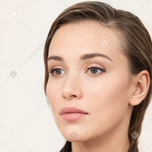 Neutral white young-adult female with long  brown hair and brown eyes