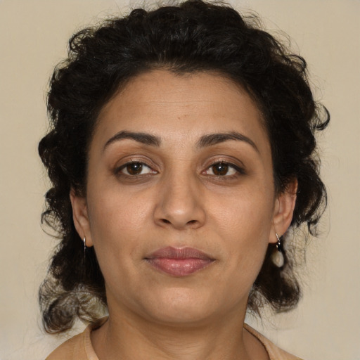 Neutral latino adult female with medium  brown hair and brown eyes