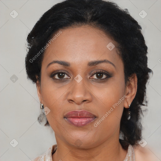 Joyful black adult female with medium  brown hair and brown eyes