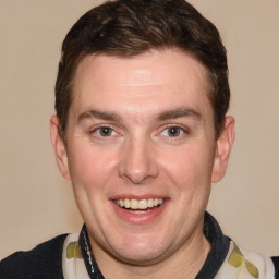 Joyful white adult male with short  brown hair and grey eyes