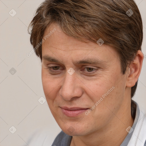 Joyful white adult male with short  brown hair and brown eyes