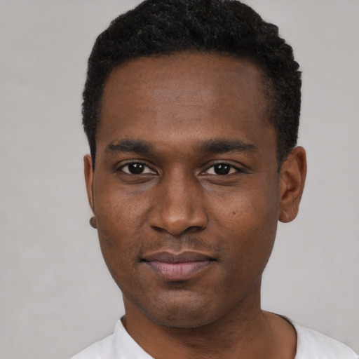 Neutral black young-adult male with short  black hair and brown eyes