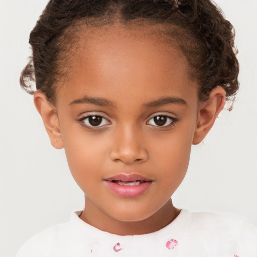 Joyful white child female with short  brown hair and brown eyes