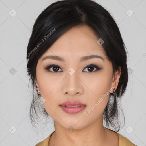 Joyful asian young-adult female with medium  black hair and brown eyes