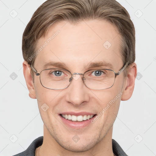 Joyful white adult male with short  brown hair and grey eyes