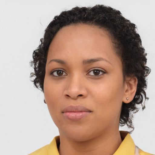 Neutral black young-adult female with medium  brown hair and brown eyes