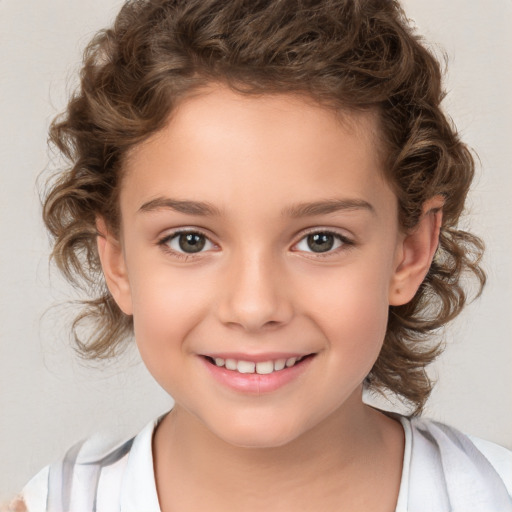 Joyful white child female with medium  brown hair and brown eyes