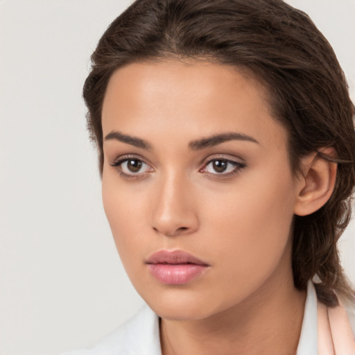 Neutral white young-adult female with long  brown hair and brown eyes