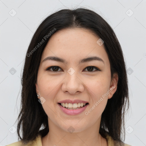 Joyful asian young-adult female with long  brown hair and brown eyes