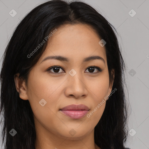 Joyful latino young-adult female with long  brown hair and brown eyes