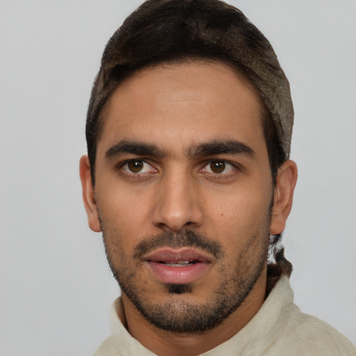 Neutral white young-adult male with short  black hair and brown eyes