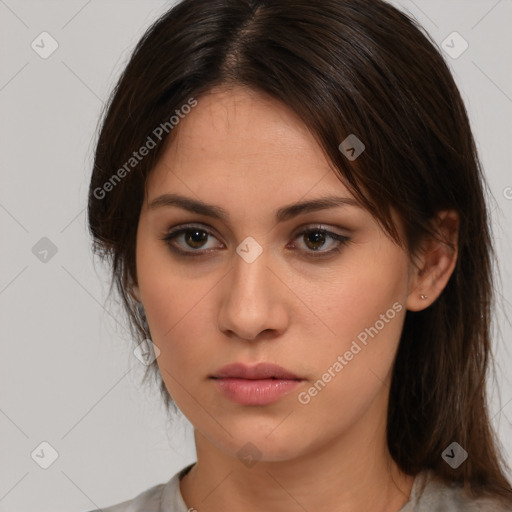 Neutral white young-adult female with medium  brown hair and brown eyes