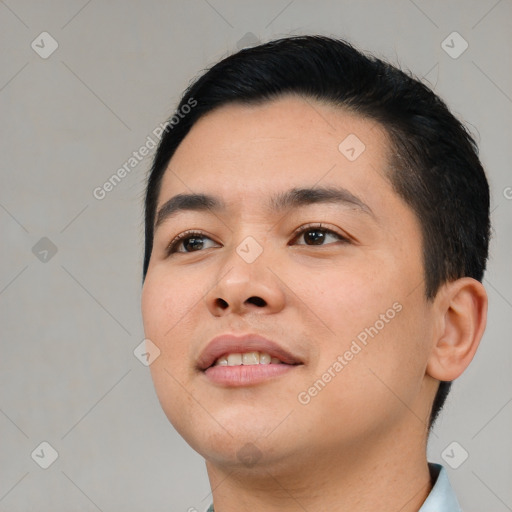 Joyful white young-adult male with short  black hair and brown eyes