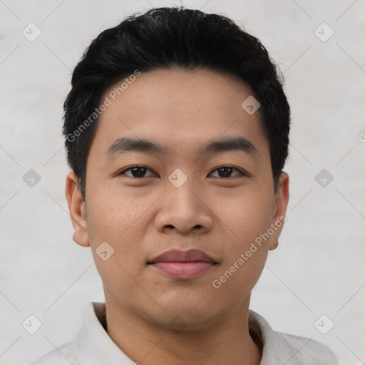 Joyful asian young-adult male with short  black hair and brown eyes