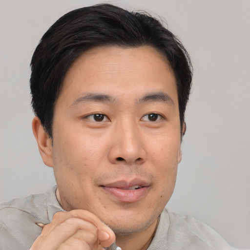 Neutral asian young-adult male with short  brown hair and brown eyes